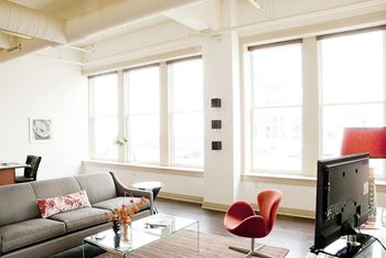 Bright loft living room with modern furniture